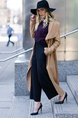 Blonde fashion model in a business outfit leaving Calgary business office