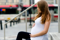 Pregnant Viktoriya with the C-Train in the background
