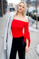 Fashion blonde model with red shirt in early spring in Calgary