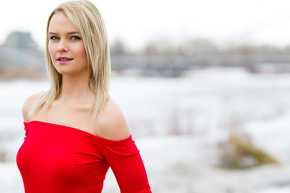 Fashion blonde model with red shirt in early spring in Calgary