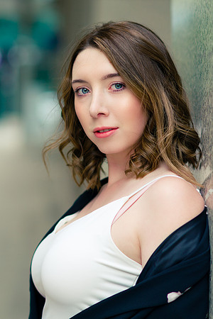 Brunette woman model portrait in white shirt