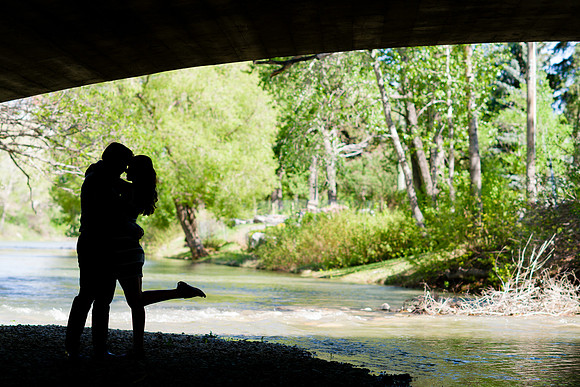 Couple Engagement Silhouette Kiss Under a Bridge